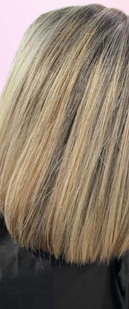 Blonde balayage on a sleek blunt lob